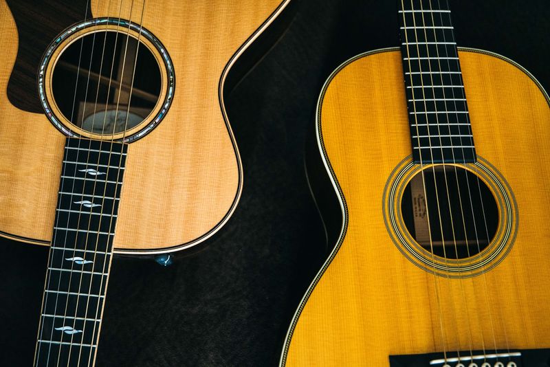 Two acoustic guitars, soundholes and neck pattern