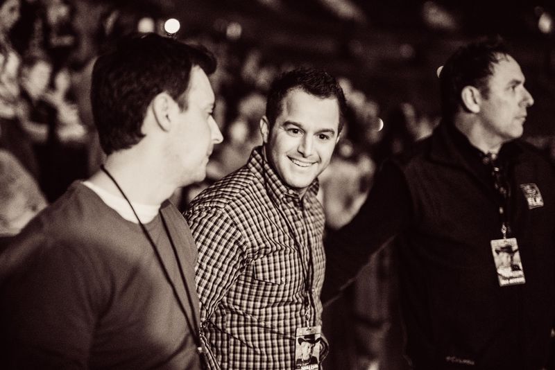 Sepia Corbin grinning with crew watching show