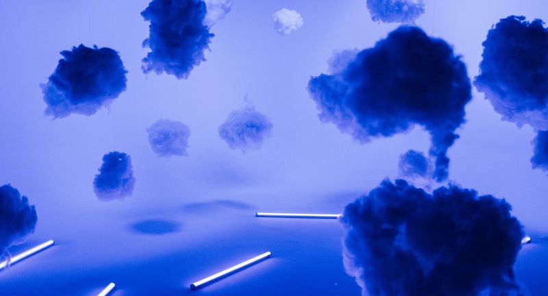 Blue clouds over floor tube lights, empty set