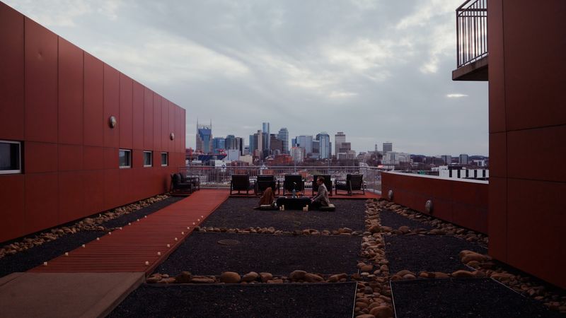 Rooftop terrace corridor framing Nashville skyline
